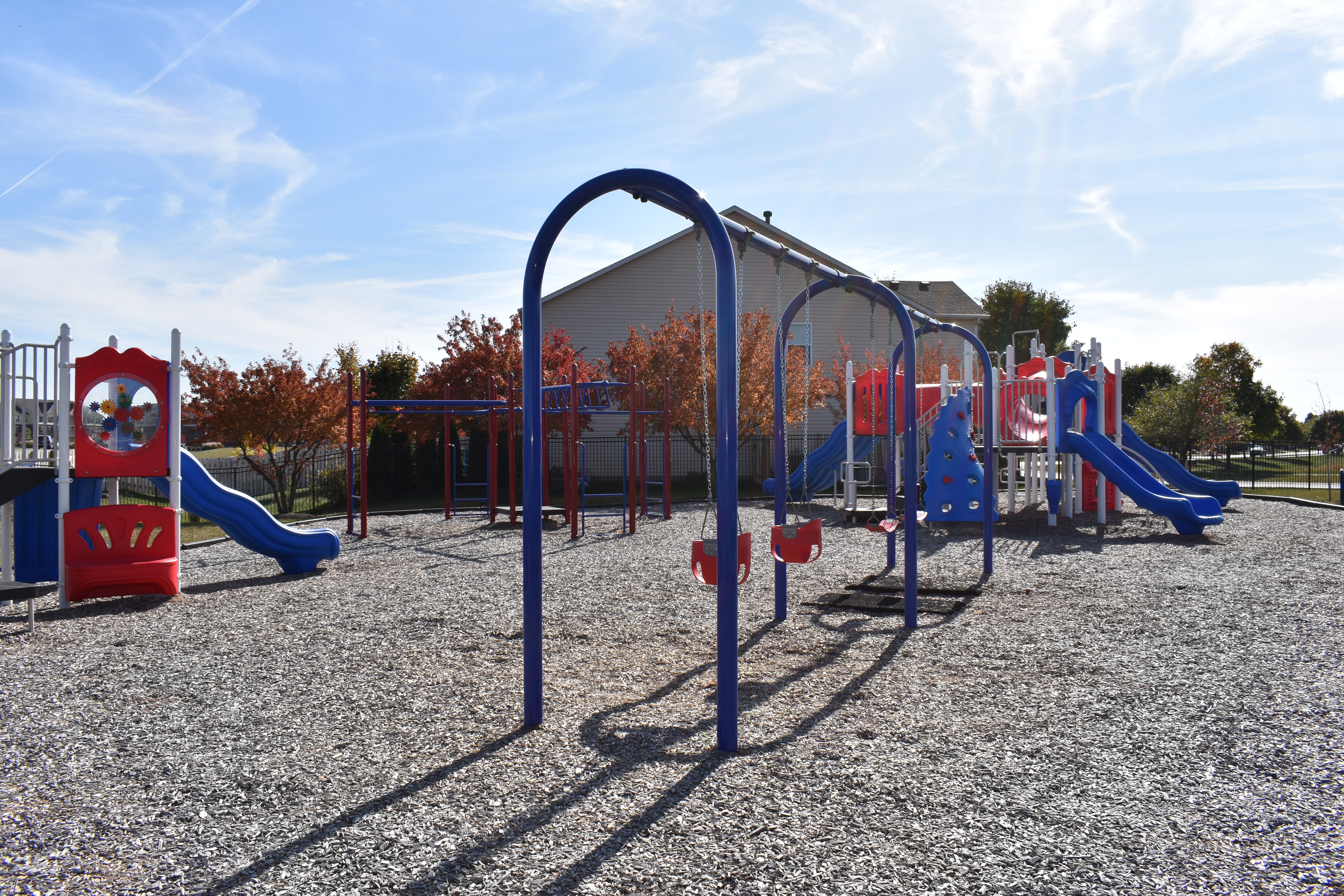 swing set on wood fiber mulch